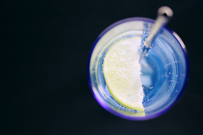 Close-up of a drink with a lemon slice.