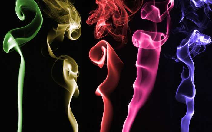 Rainbow-toned smoke coming from recently-extinguished candles.