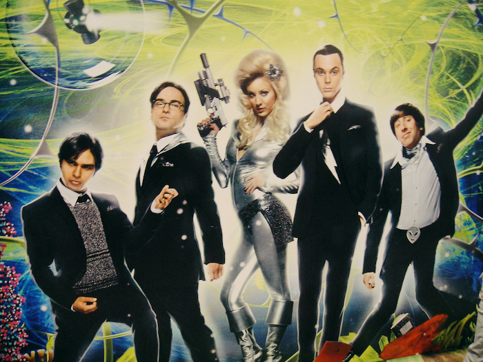 Cast of the Big Bang Theory in a 60s-themed poster.